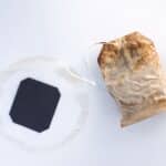 dried used tea bag placed on a surface